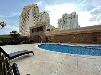 a swimming pool in a building with tall buildings at Luxury hub in Dubai