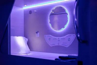 a small room with a bed and a mirror at Berloga Holiday Homes JBR in Dubai