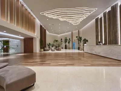 a lobby with a large lobby with a large ceiling at Luxury Apt DIFC, XL Layout, Pool, Gym, Skyline View in Dubai
