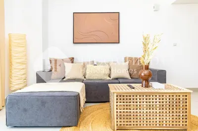 a living room with a couch and a table at Bloomfields 1br Elegant Escape The Pulse in Dubai