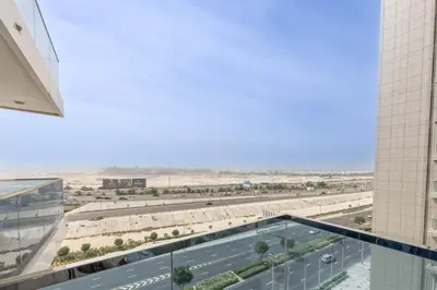 a view of the desert from a building at Cozy Studio 7 Minutes From Dubai Mail in Dubai