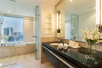 a bathroom with a sink and a mirror at The Prestige in Dubai