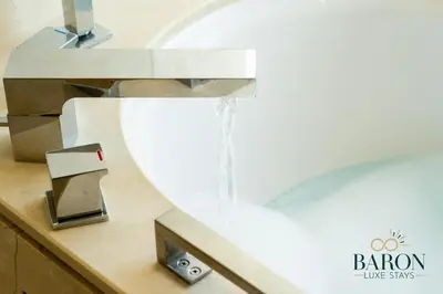 a bathroom sink with water coming out of a faucet at The Prestige in Dubai