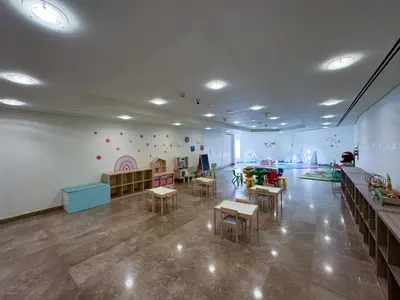 a large room with tables and chairs in a room with a room at King Bed & Modern Comfort Studio in DIFC Downtown in Dubai
