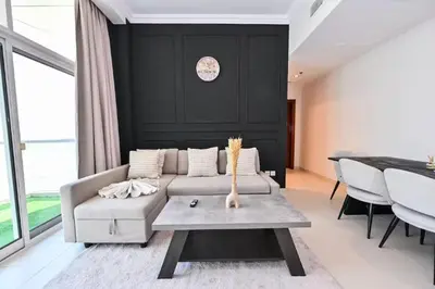 a living room with a couch and a table at Scala Tower- Business Bay Dubai - Luxury Apartments by Canvas Holiday Homes in Dubai