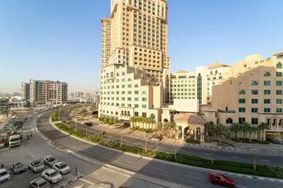 a city with tall buildings and a street with cars at Chic 2BR Close to Burj Khalifa, Dubai Mall & Creek in Dubai