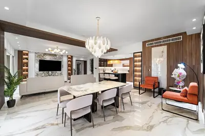 a dining room with a table and chairs at 3BR plus Maid Rimal 4 Direct Beach Access in Dubai