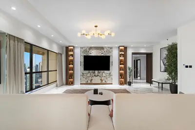 a living room with a tv and a couch at 3BR plus Maid Rimal 4 Direct Beach Access in Dubai