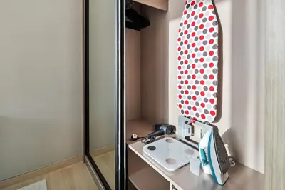 a bathroom with a sink and a mirror at Luxury 1BR JVC Pool & Balcony by Circle Mall in Dubai