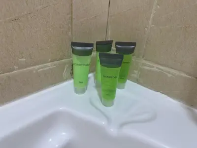 two green bottles sitting on top of a bath tub at Dubai Marina-2Bedroom-3 balcony with view-direct acces to Marina Promenade in Dubai