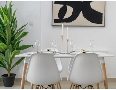 a white dining room table with two white chairs at Dubai Marina-2Bedroom-3 balcony with view-direct acces to Marina Promenade in Dubai
