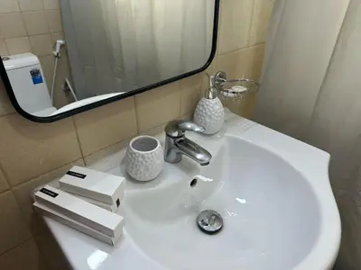 a white bathroom sink with a mirror and a sink at Dubai Marina-2Bedroom-3 balcony with view-direct acces to Marina Promenade in Dubai