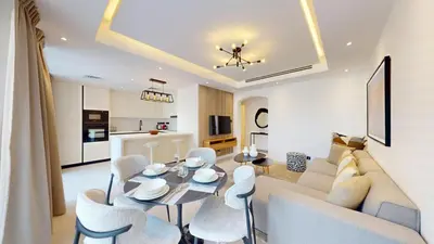 a living room with a couch and a table and chairs at Ranches 1 Upgraded Three Bedroom Villa in Dubai