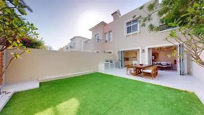 a large backyard with a green lawn at Ranches 1 Upgraded Three Bedroom Villa in Dubai