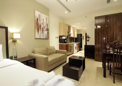 a hotel room with a bed and a living room at Breathtaking Views from a H-Floor Studio in Dubai in Dubai