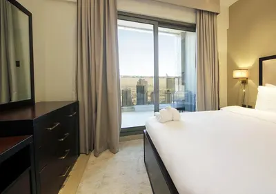 a hotel room with a bed and a large window at Breathtaking Views from a H-Floor Studio in Dubai in Dubai