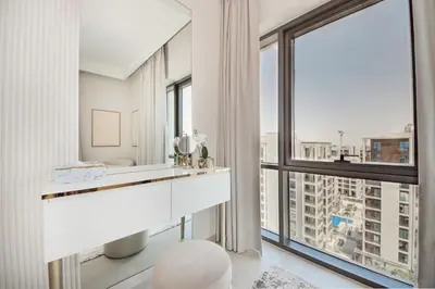 a room with a white desk and large windows at Modern 2BR Apartment - Vida Residences Creek Beach - Creek Beach Access in Dubai