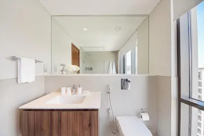 a bathroom with a sink and a mirror at Modern 2BR Apartment - Vida Residences Creek Beach - Creek Beach Access in Dubai