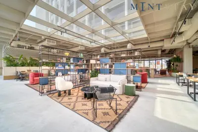 an office lobby with a lot of chairs and tables at THE UPSIDE Downtown Dubai in Dubai