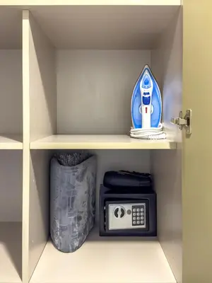 a shelf with a radio and a toy on it at Infinity Rooftop Pool with Full Burj Khalifa View in Dubai