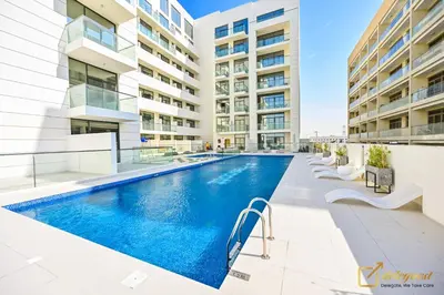 an image of a swimming pool in a building at New Studio 5min Walk to Bus Stop in Dubai