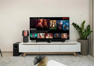 a flat screen tv sitting on top of a white entertainment center at Cozy 1BR The Address JBR in Dubai