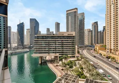 a view of a city with a river and buildings at Bay Central Modern Studio in Dubai