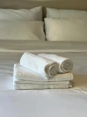 two towels sitting on top of two beds at Act tower-1BR near burj khalifa in Dubai