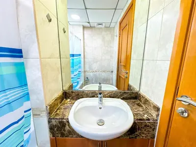 a bathroom with a sink and a tub at Luxe Vista - Top Location Dubai Marina 1BR - Metro and Beach Access in Dubai