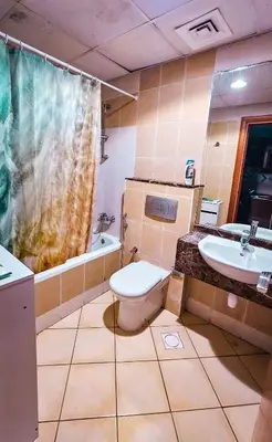 a bathroom with a toilet and a sink at Upgraded Studio In Dubai Marina in Dubai