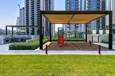 a gazebo in a city with tall buildings at Brand New Stylish 2 BR with Balcony in Dubai