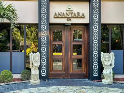 two statues in front of a building with a door at Oceanfront 2BR Apartment with Perfect Views in Dubai