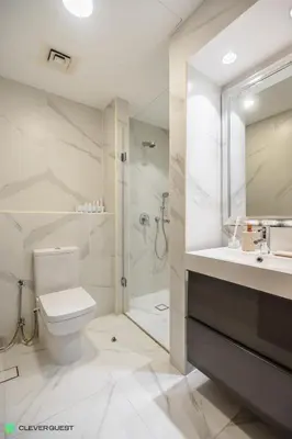 a bathroom with a toilet and a sink and a shower at Clever Guest 030 Golden Mile 6 in Dubai