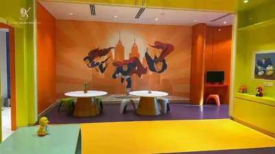 a room with two tables and a mural on the wall at Bellaviu Holiday Homes Peaceful Escape at DAMAC Maison Prive in Dubai