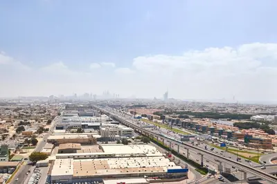 an aerial view of a city with a highway at Aykon City 2BR Luxury Stay Close to Downtown in Dubai