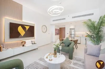 a living room with a couch and a table at Vogue Madinat Jumeirah Living Jadeel near Burj AlArab, One-Bedroom Apartment with Large Balcony and Pool View, Access to All Amenities in Dubai