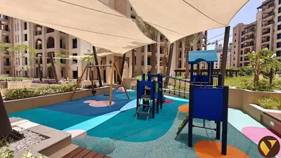 a playground with a swing set in a building at Vogue Madinat Jumeirah Living Jadeel near Burj AlArab, One-Bedroom Apartment with Large Balcony and Pool View, Access to All Amenities in Dubai