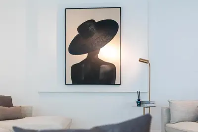 a picture of a person wearing a hat in a living room at Elite Villa in Dubai in Dubai