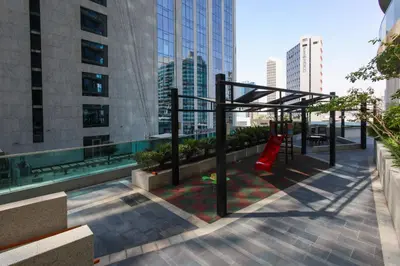 a playground on the roof of a building at studio in downtown Damac upper crest next to dubai mall in Dubai