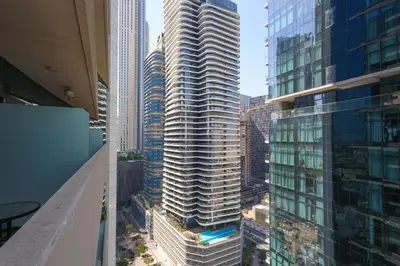 an aerial view of a tall building in a city at studio in downtown Damac upper crest next to dubai mall in Dubai
