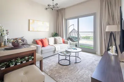 a living room with a couch and a table at Frank Porter - Kappa Acca 3 in Dubai
