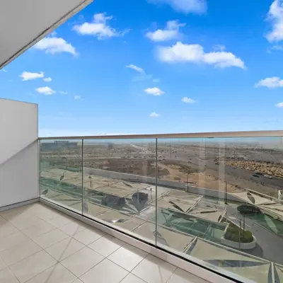 a view of an airport through a large glass window at Damac Hills Carson A Monthly Stay - Pay 28, Stay 30 in Dubai