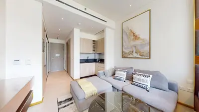 a living room with a couch and a glass table at Signature Livings - Bright Studio in JVC in Dubai