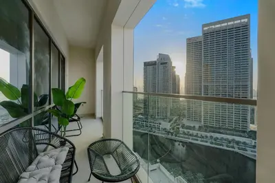 a balcony with a view of a city skyline at Tranquil & Modern 2BR - Vida Residence Creek Beach in Dubai
