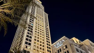 a tall white building with a nord sign on it at Tranquil & Modern 2BR - Vida Residence Creek Beach in Dubai