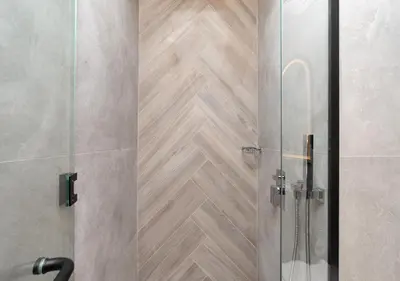 a shower with a glass door in a bathroom at Burj View - Luxury Studio - Near Dubai Miracle & Butterfly Garden- Arjan, Dubailand in Dubai