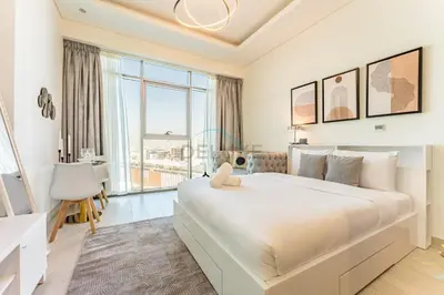 a white bedroom with a large bed and a large window at Studio Near Dubai Creek, Dubai Frame & Downtown, Farhad Azizi, Al Jaddaf by Deluxe Holiday Homes in Dubai