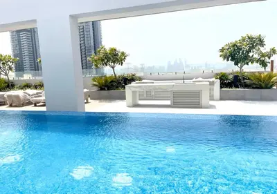 a view of a swimming pool in a building at Bespoke Holiday Homes - Stylish 2BR in Oxford 212 JVC in Dubai