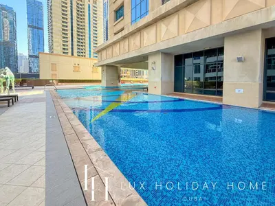 a swimming pool in the middle of a building at LUX The Al Seef Marina 4 bed Suite in Dubai