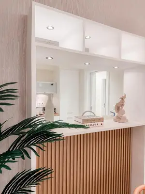 a large mirror on the wall of a kitchen at Dubai Marina Promenade 1BR Apartment with Pool near JBR in Dubai